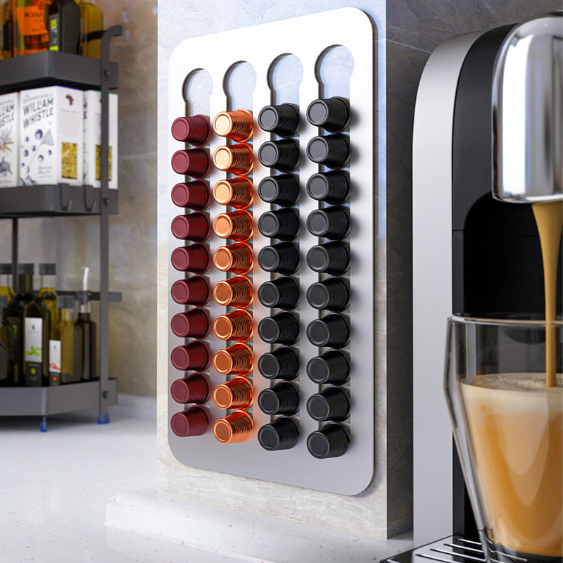 Drill-free stainless steel wall-mounted coffee capsule storage and display rack.