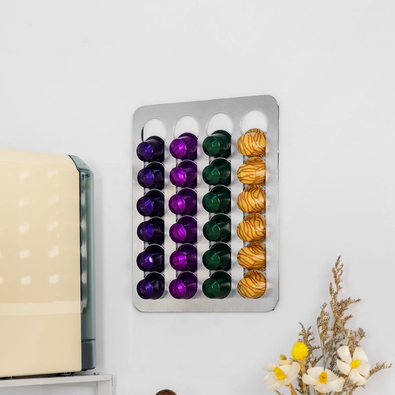 Drill-free stainless steel wall-mounted coffee capsule storage and display rack.